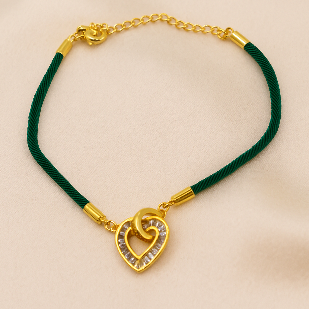 إسواره لون ذهبي مع شريط ناعم أخضر