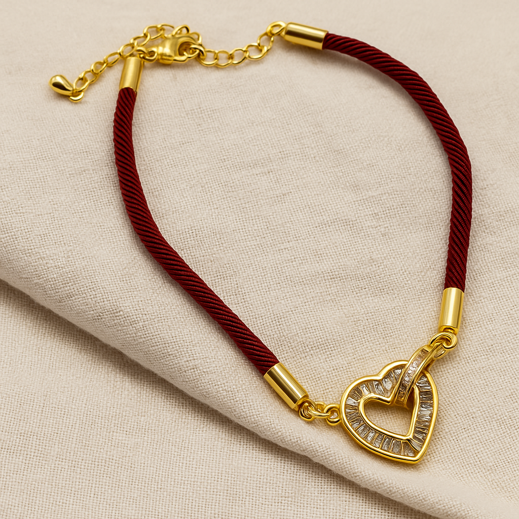 إسواره لون ذهبي مع شريط ناعم أحمر